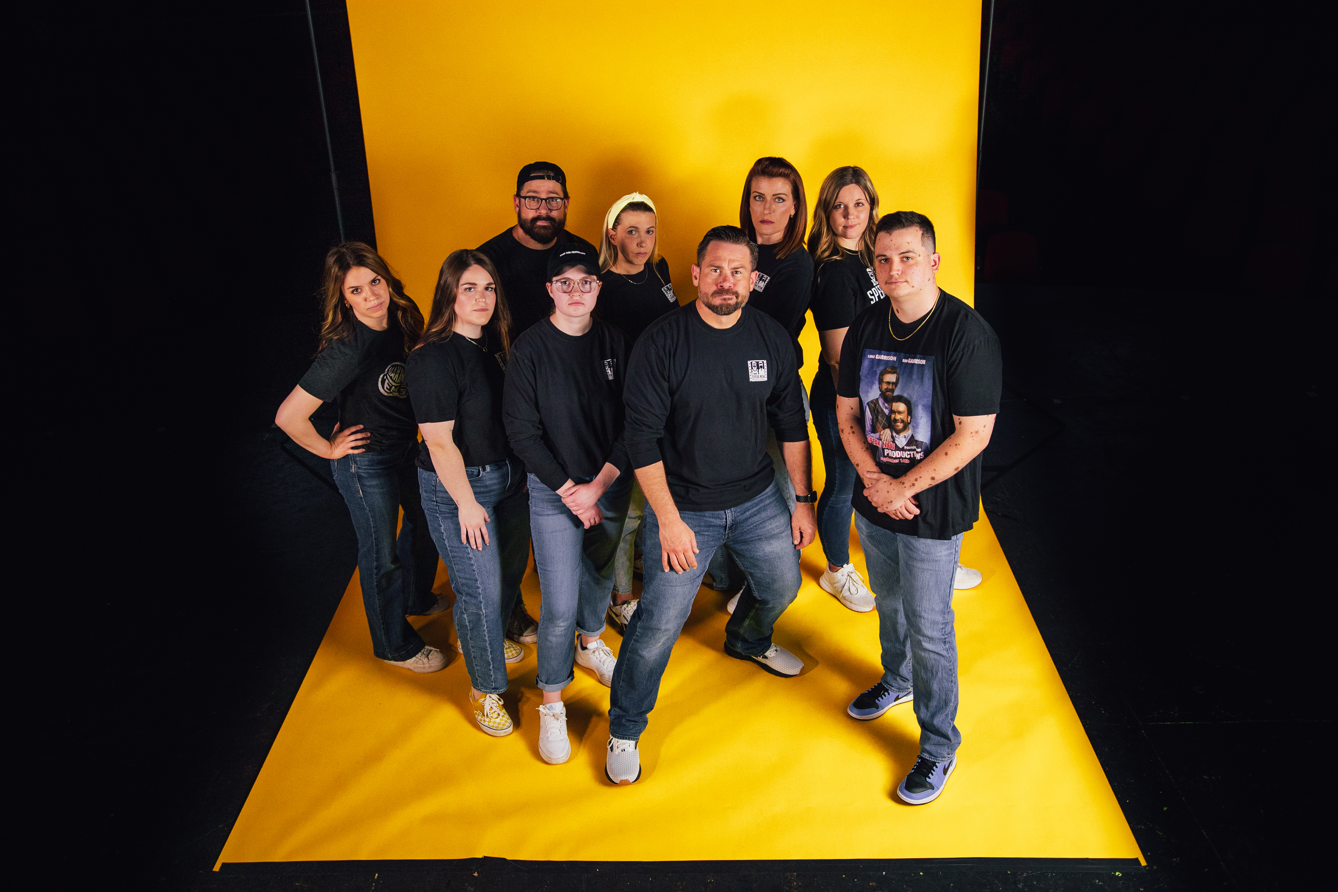 Speak Now Productions team on a yellow studio backdrop